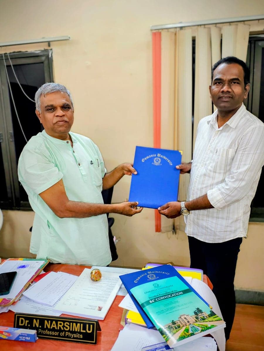 Dr Rajeshwar Reddy being handed an Osmania University folder in the Department of Physics